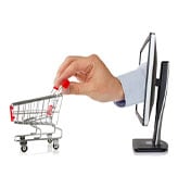 Giant hand protruding from computer screen and pushing a shopping cart