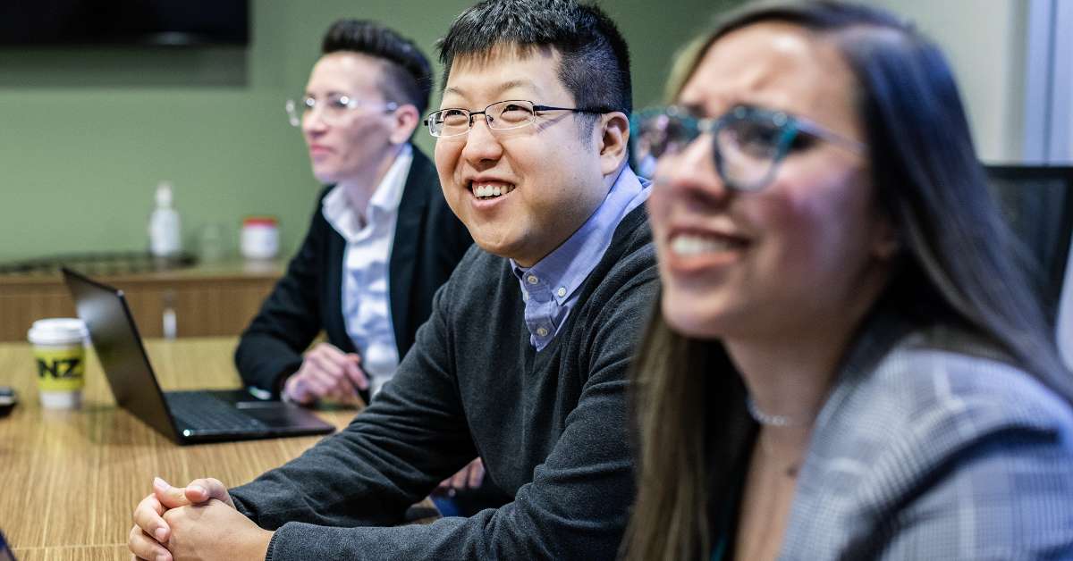 DOM Team Members collaborating in conference room