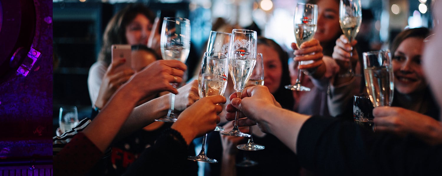 Beating the Competition in Digital Marketing | Group Holding Champagne Glasses