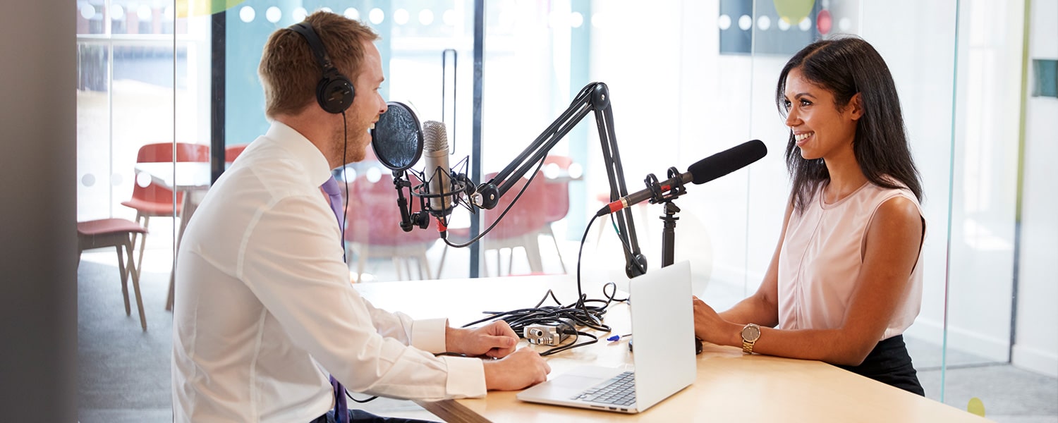 Podcasts for Business | Business Podcasting | Marketing Podcast | Two People with Podcast Setup