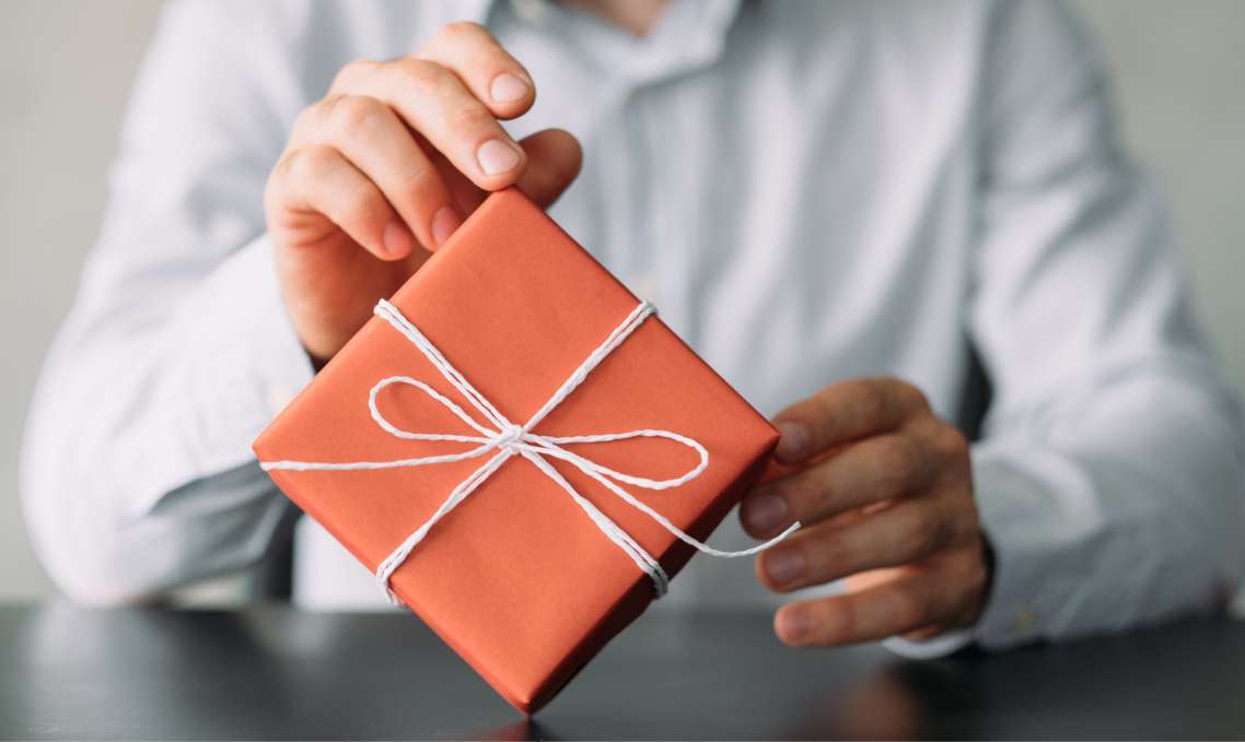 Person holding gift box